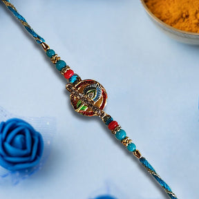 Beautiful Rakhi With Feather And Pearls In Middle - Rakhi | Desimart