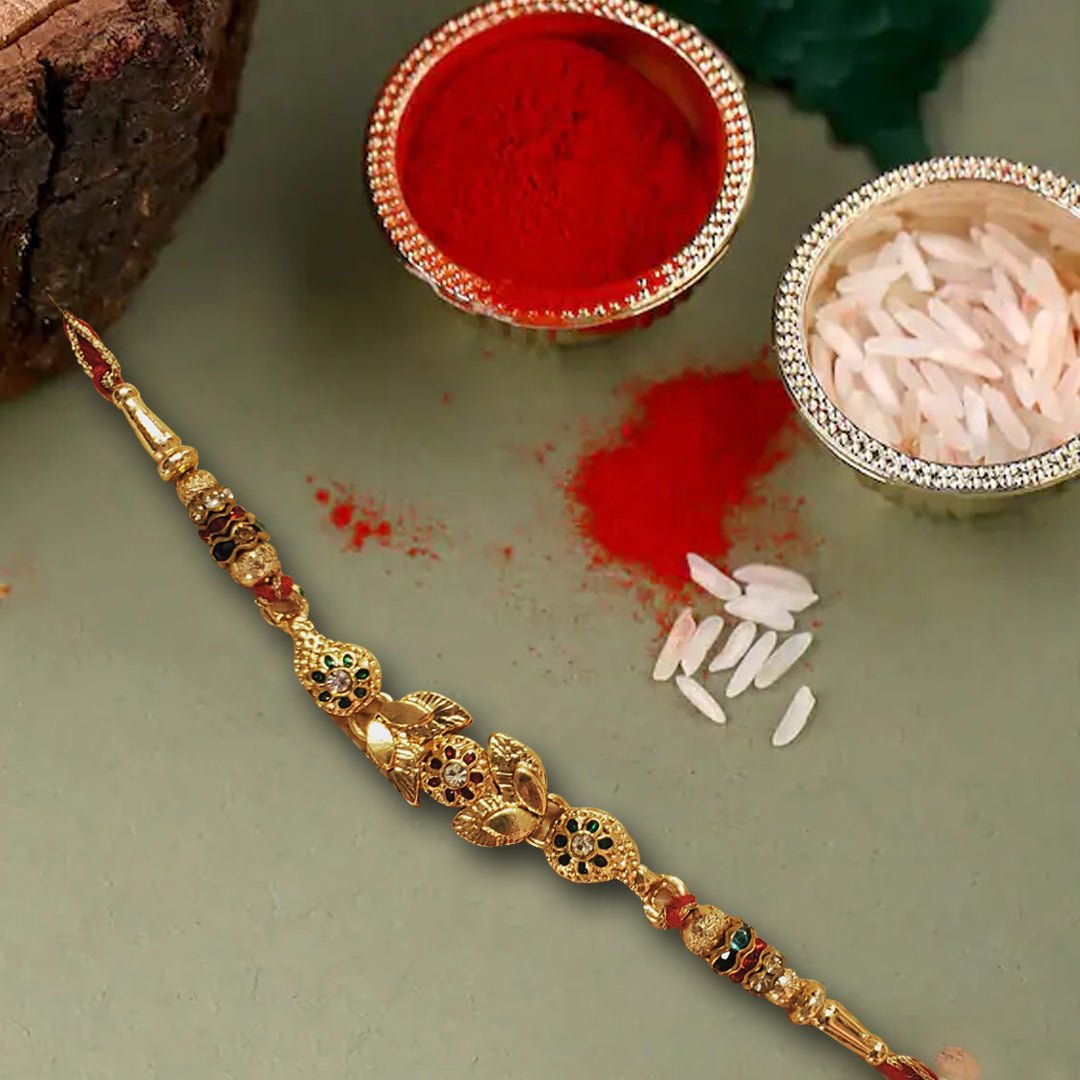 Golden Finish Rakhi With Beautiful Red Pouch - Rakhi | Desimart